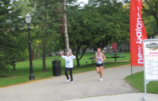 Here I am (left) giving a thumbs-up to my coworker’s husband seconds before finishing.