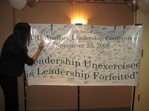 Signing the 2008 banner "Leadership Unexercised is Leadership Forfeited" 
